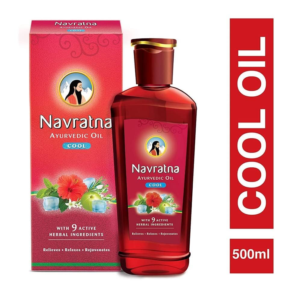 Close-up of Navratna Cool Oil ingredients: Bringraaj, Brahmi, Amla