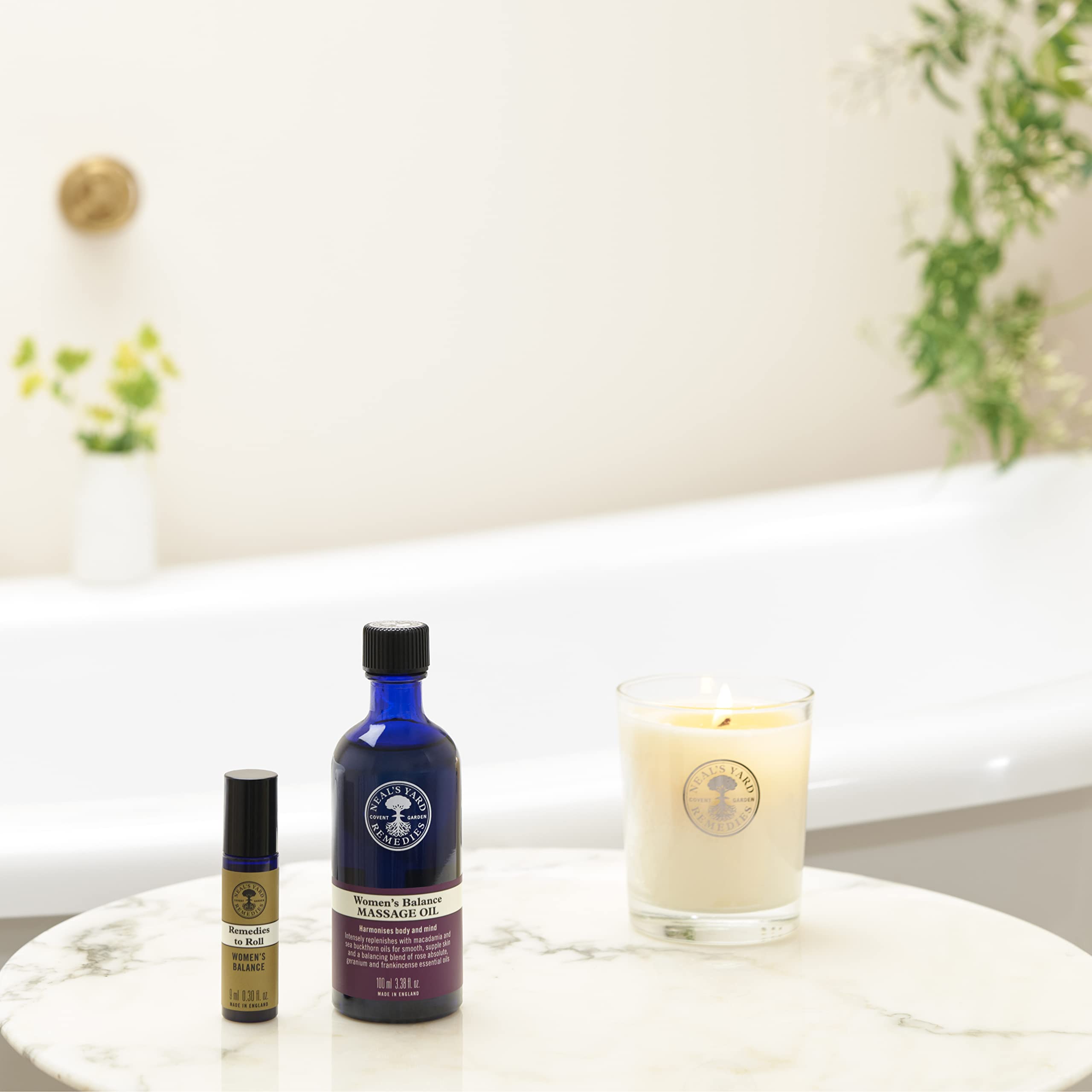 Macadamia oil and sea buckthorn shown as ingredients for Women's Balance Massage Oil
