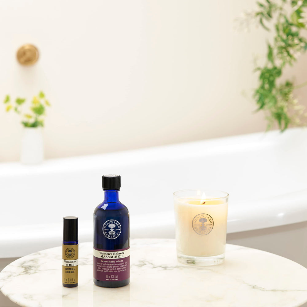 Macadamia oil and sea buckthorn shown as ingredients for Women's Balance Massage Oil