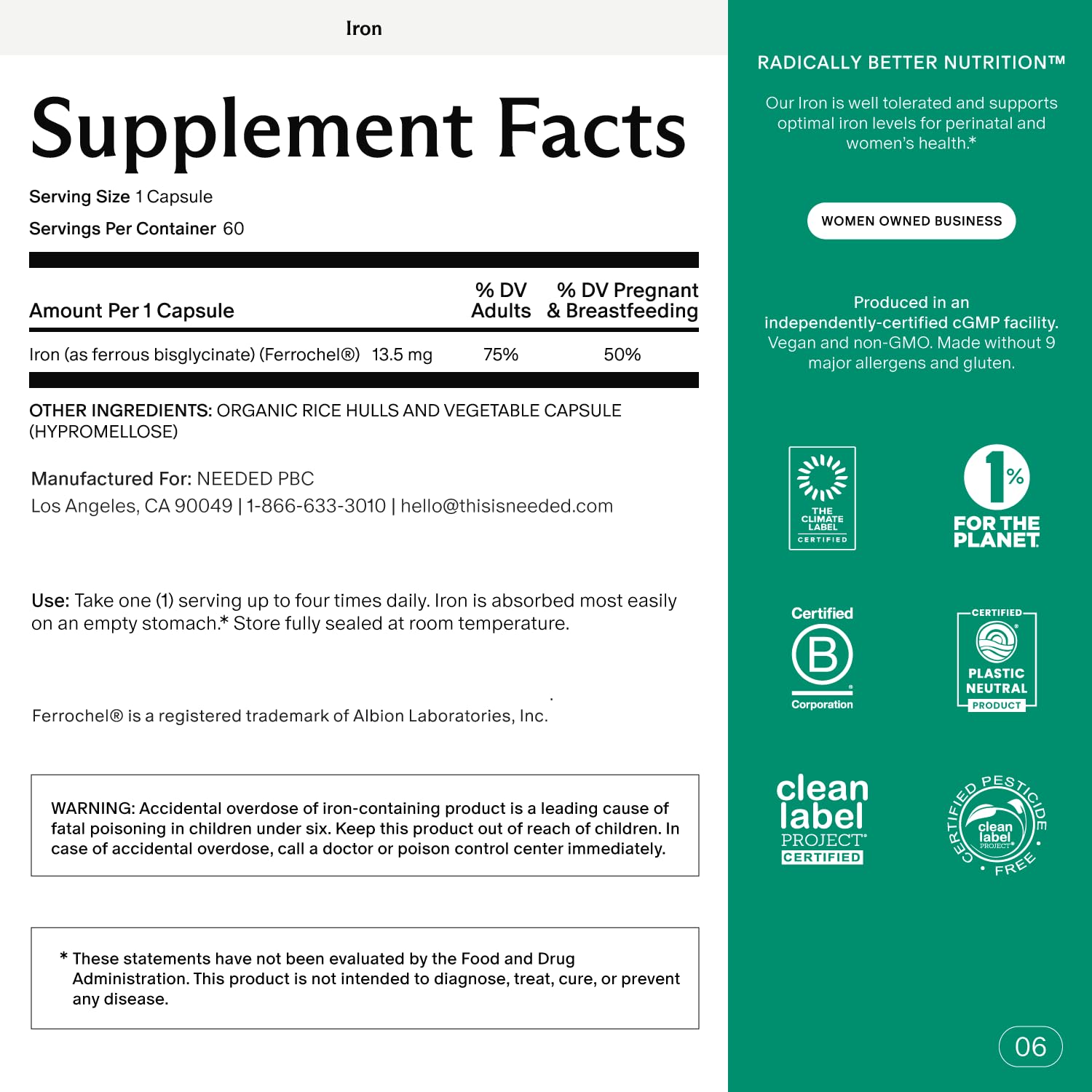 Pregnant woman holding iron supplement