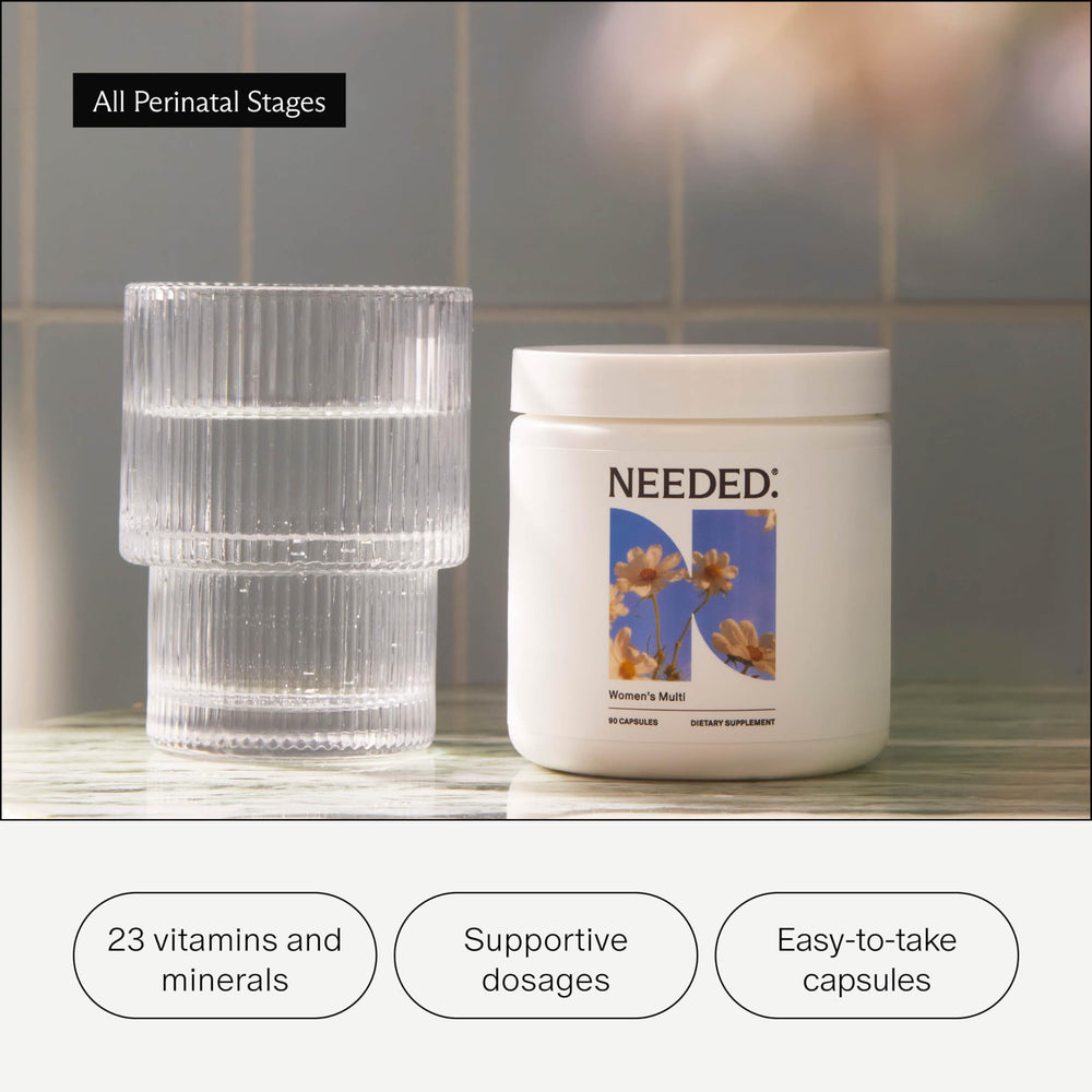 Needed Women's Multi capsules in hand, a convenient daily wellness option.