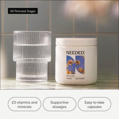Needed Women's Multi capsules in hand, a convenient daily wellness option.
