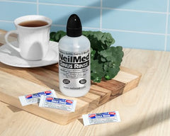 NeilMed Sinus Rinse bottle dispense action demonstrates adjustable pressure for personalized rinsing.
