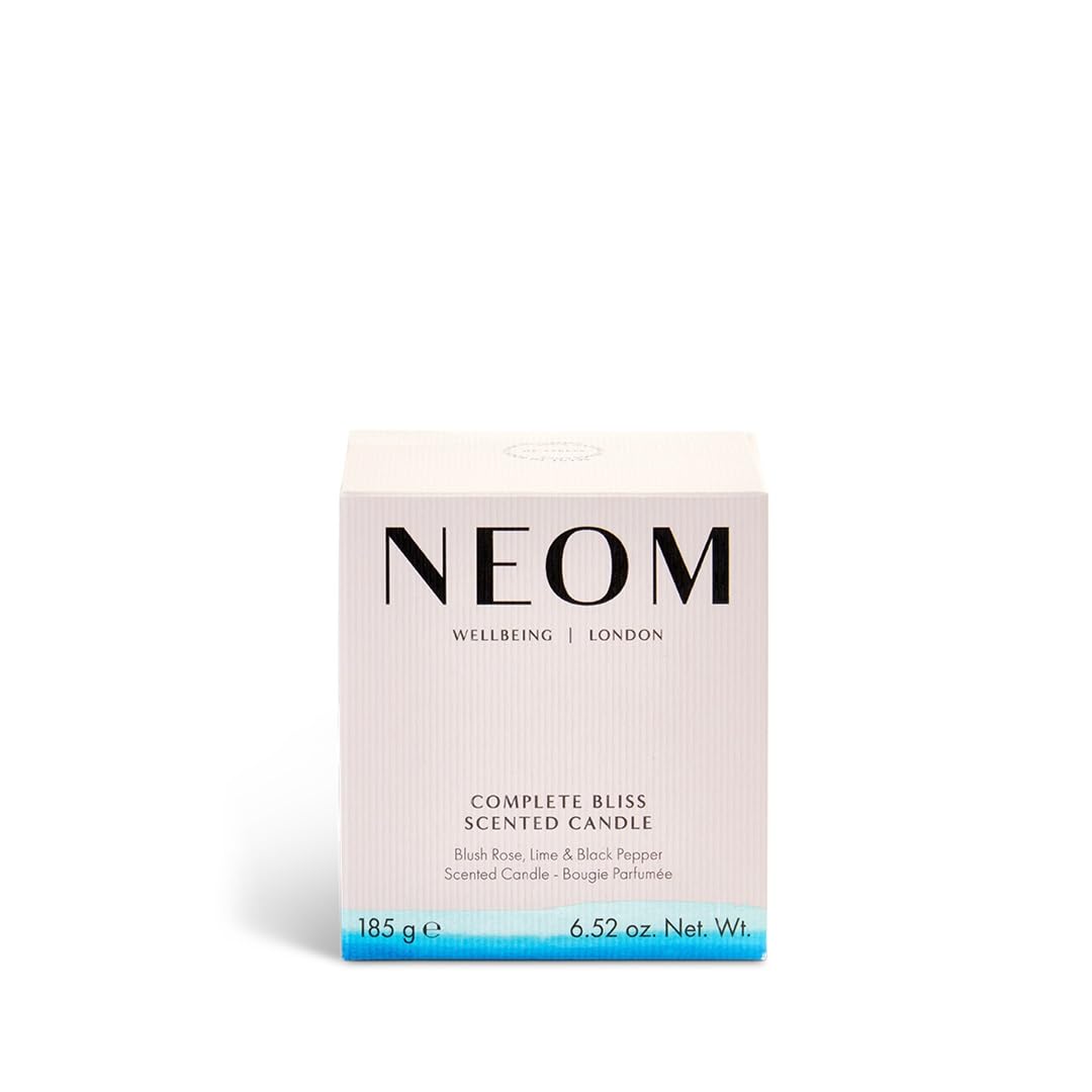 Neom Complete Bliss candle soft amber glow evokes warmth and calm during winding-down routines.