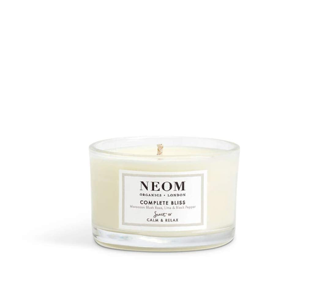 NEOM Complete Bliss wick trimmed for an even burn.