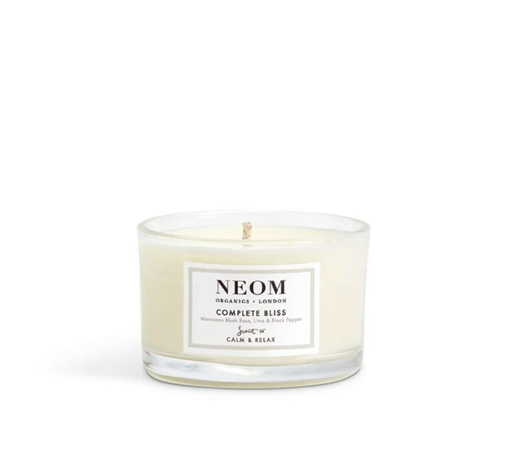 NEOM Complete Bliss wick trimmed for an even burn.