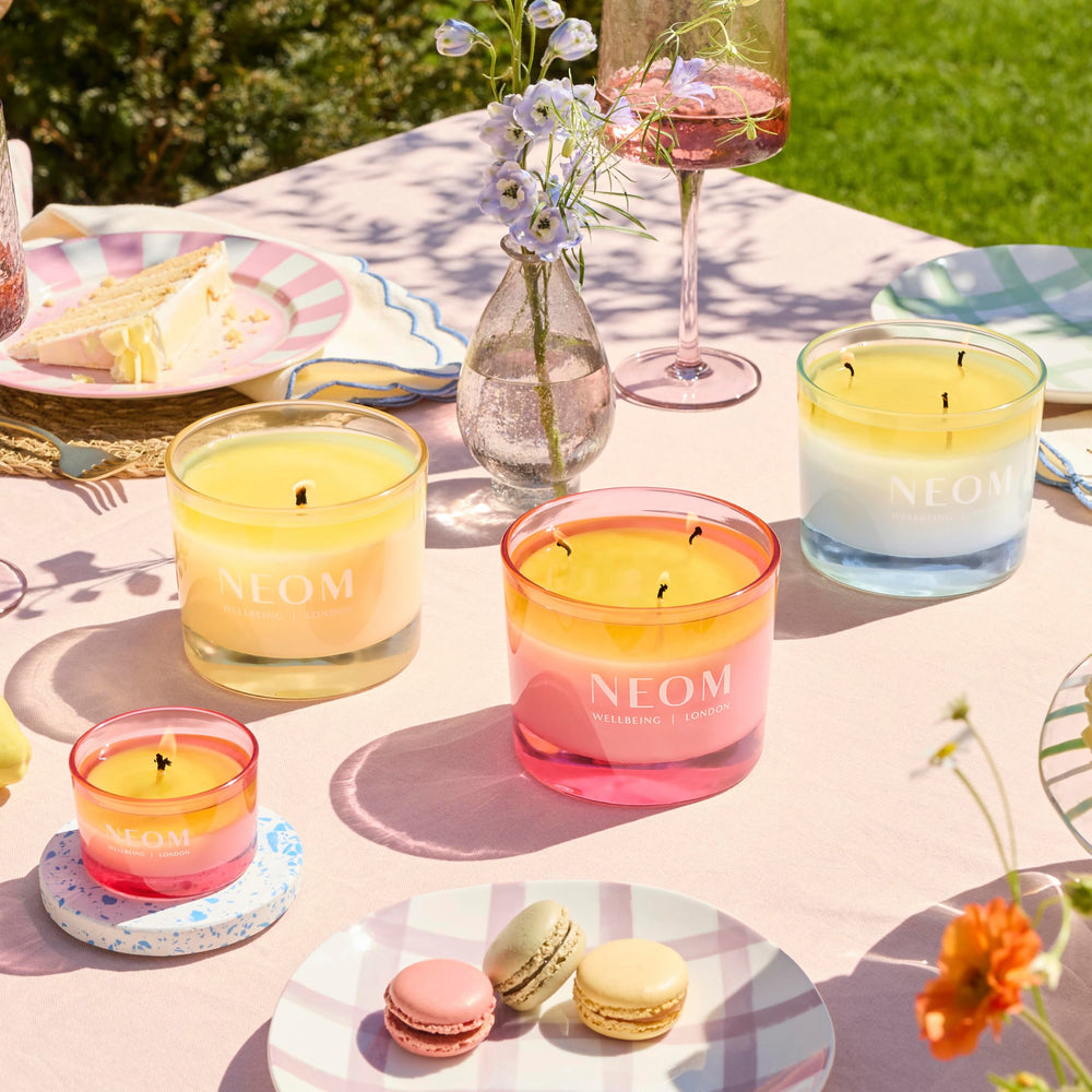 Neom Energy Burst Candle closeup wax texture highlights natural ingredients.