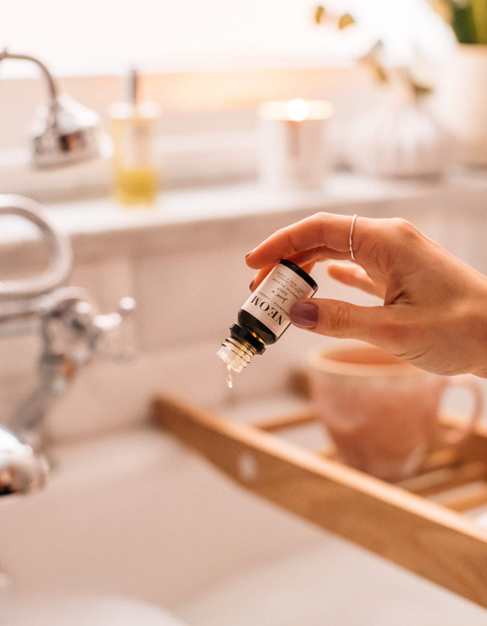 NEOM Essential Oil Blend 10ml bottle on spa setup