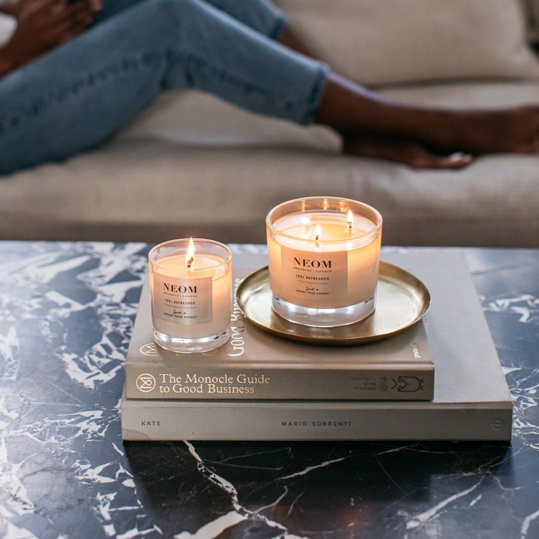 Neom Feel Refreshed glass jar on table, clean natural fragrance