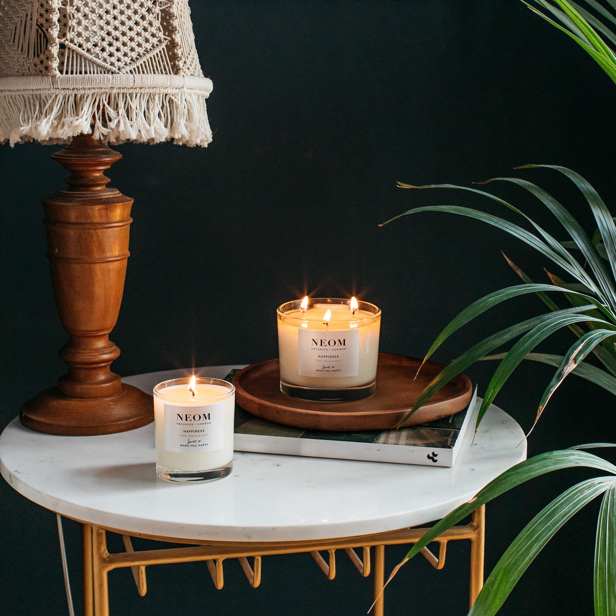 NEOM Happiness candle sustainable ingredients in premium packaging