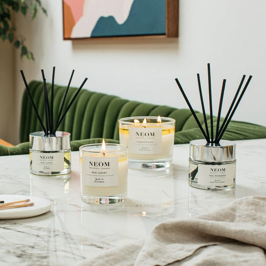 Close-up of NEOM travel candle showing lavender and jasmine blend
