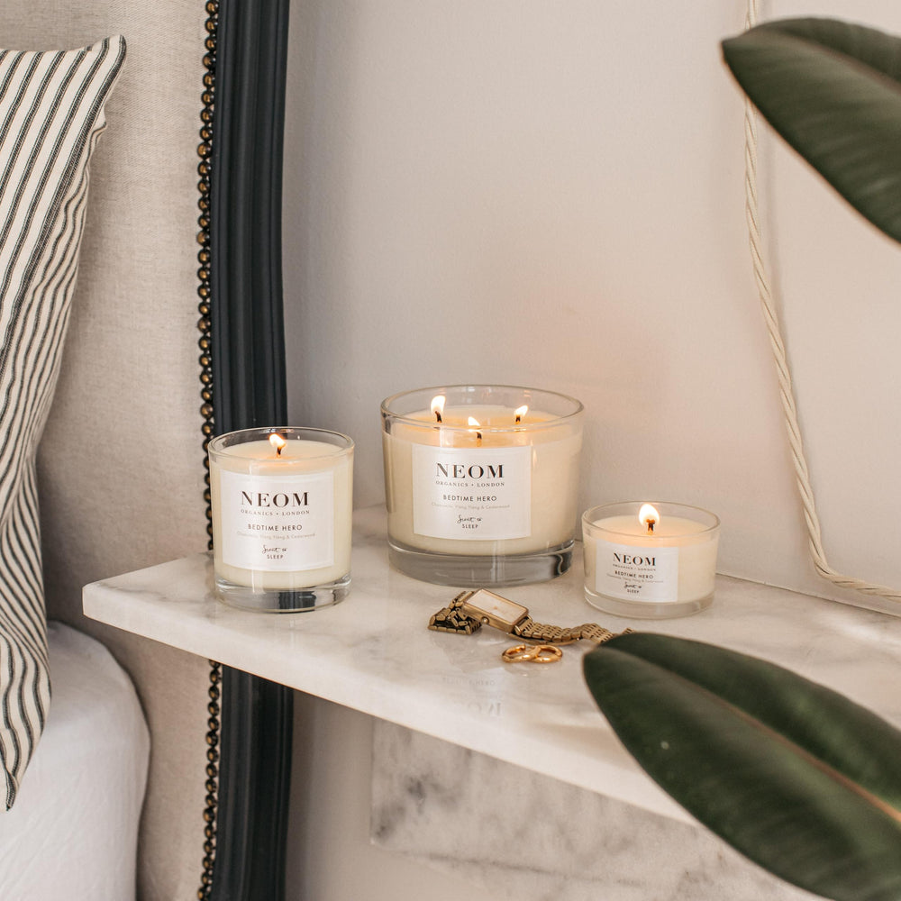 Candle glowing on a bedside table for a pre-bedtime atmosphere