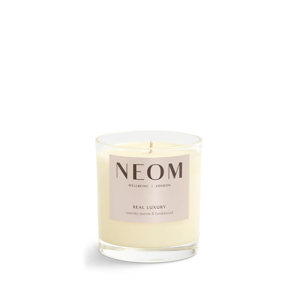 NEOM Real Luxury candle mood-relaxation scene with soft lighting.