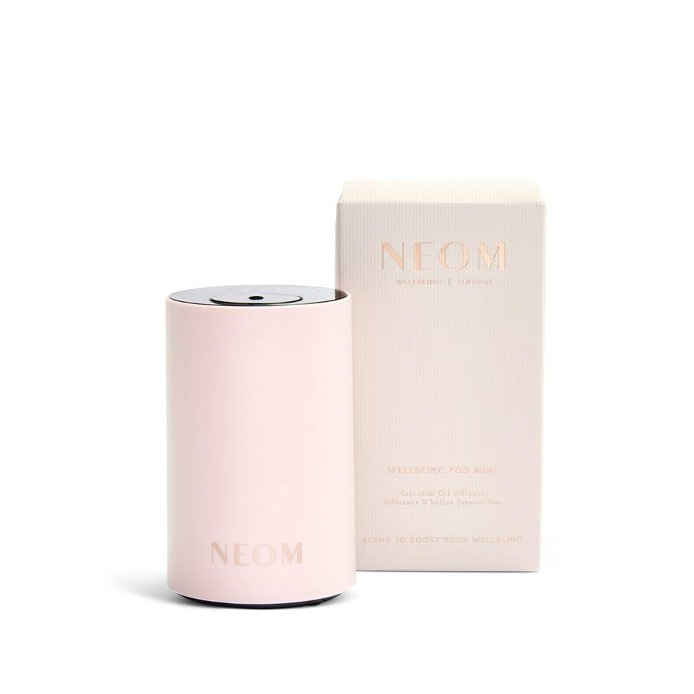 NEOM Wellbeing Pod Mini on desk offers compact aroma for focus and calm