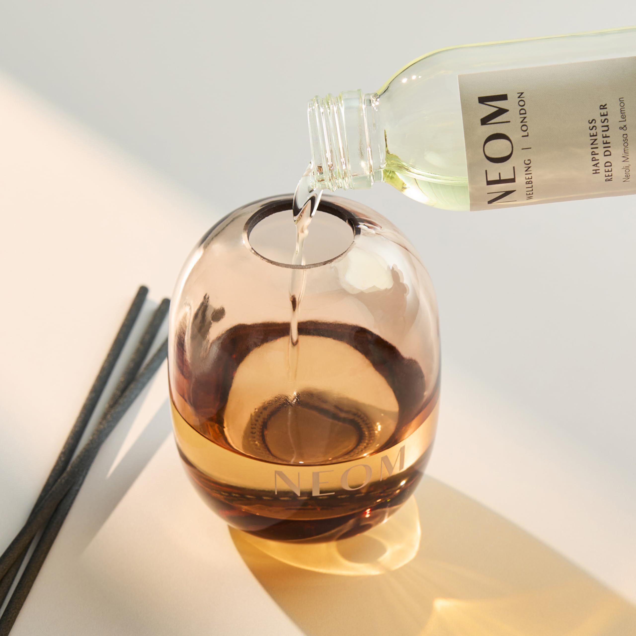 Amber glass diffuser vessel with natural reeds