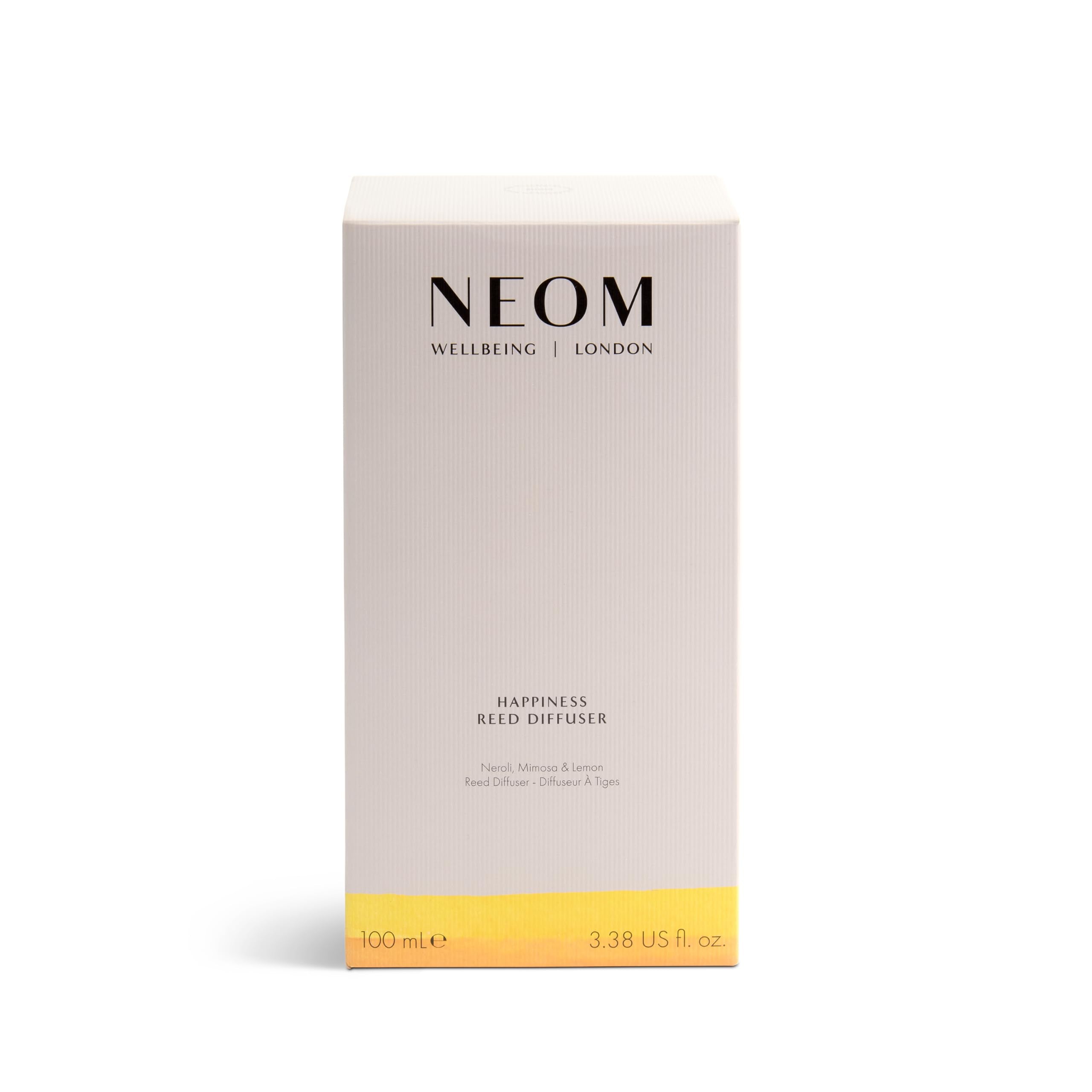 Cozy room ambience featuring the NEOM Happiness Reed Diffuser