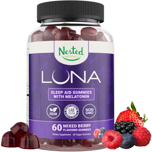 Bottle of Nested Naturals Luna Sleep Gummies on a nightstand