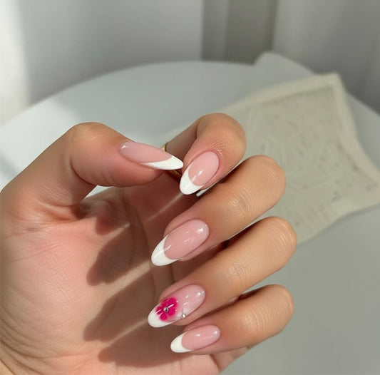 NEUQL almond-painted-flowers French tips close-up showing natural look.