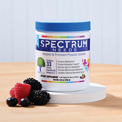 Close-up of SpectrumNeeds scoop beside bottle, illustrating simple daily dosing.