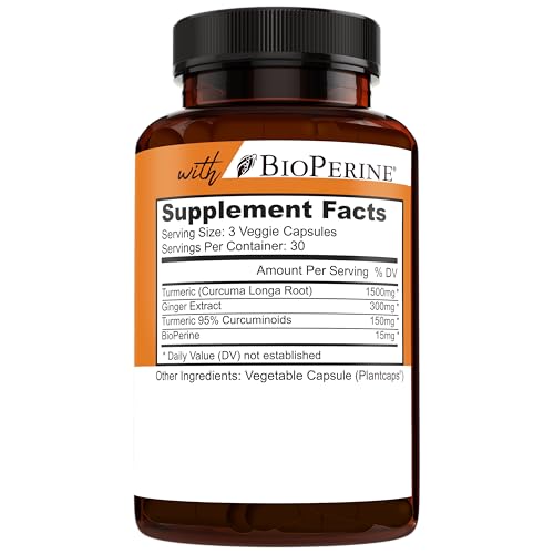 Natural turmeric roots and capsules with ingredients background