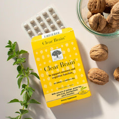 Adult taking Clear Brain capsules for cognitive health