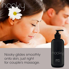 Pouring Nooky Unscented Massage Oil onto hand