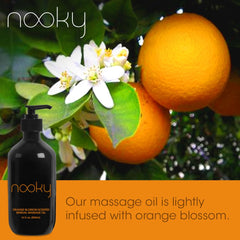 Hand applying Nooky Orange Blossom Massage Oil during a massage