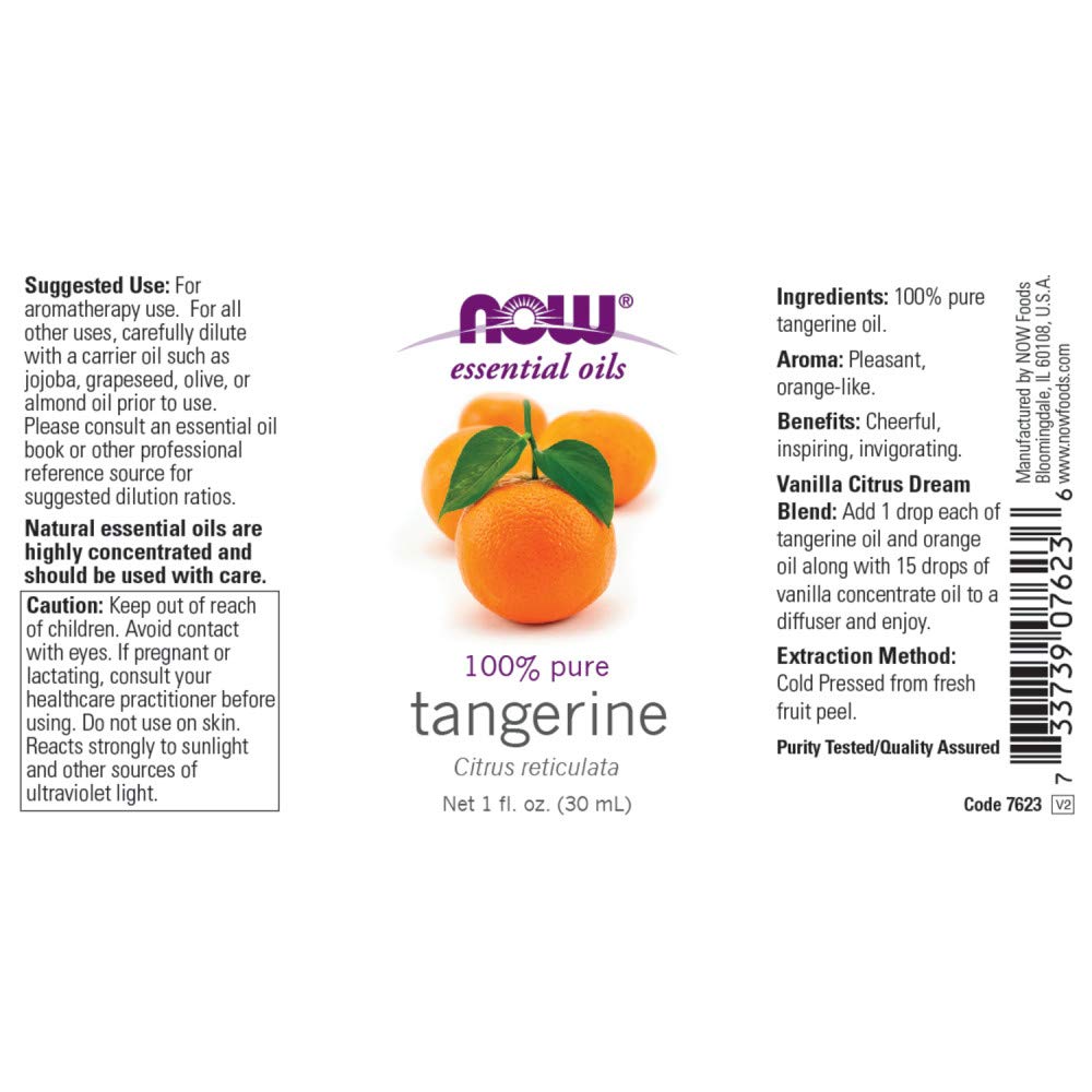 Citrus essential oils arranged with fruits and bottles