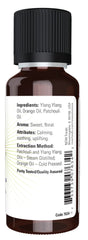 Close-up of Peace Love and Flowers essential oil bottle