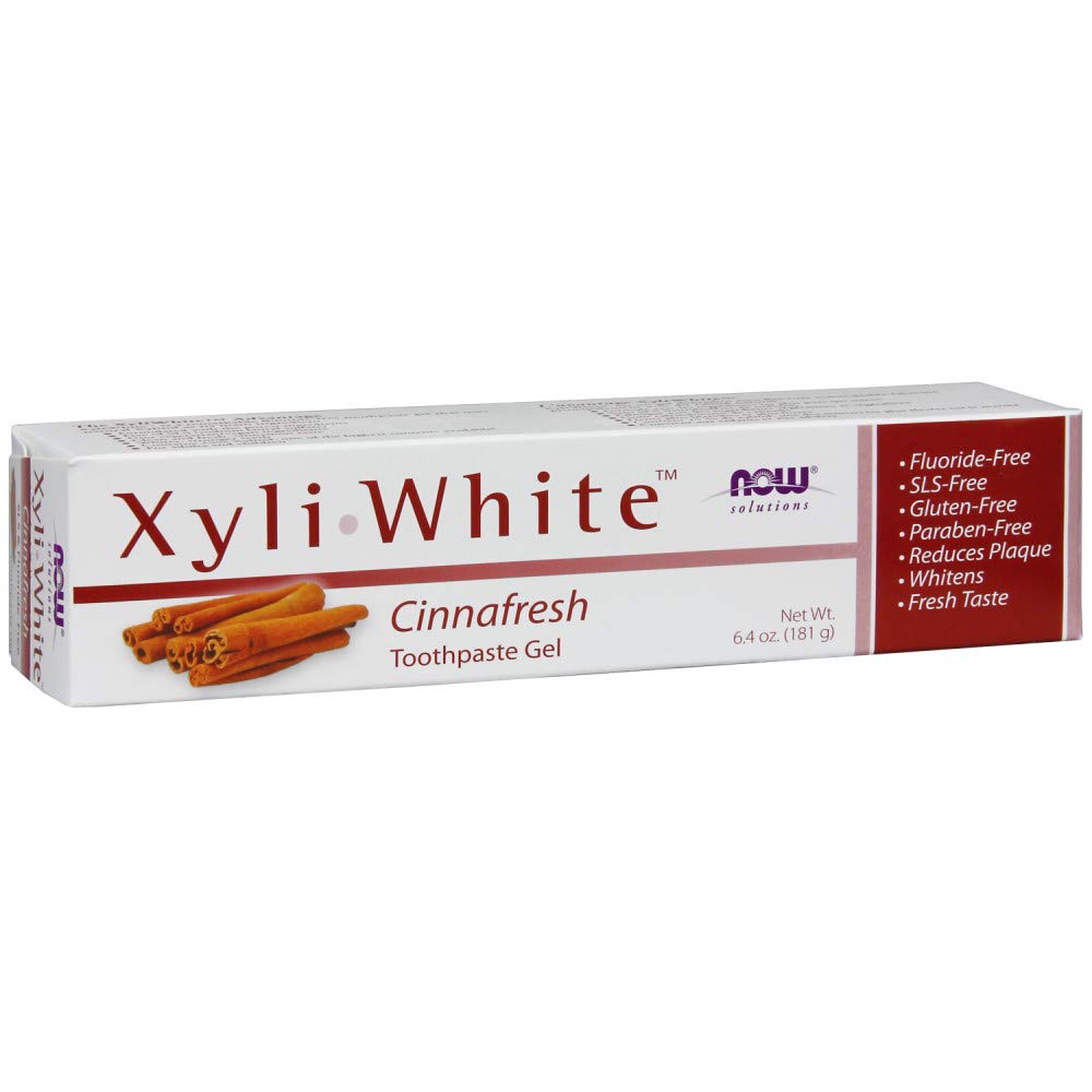 Brushing teeth with XyliWhite CinnaFresh toothpaste gel