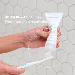 Smiling person with brighter teeth after using AP 24 toothpaste