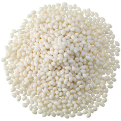 Nuanchu 100g bead teeth pellets in a white dish for DIY tooth filling