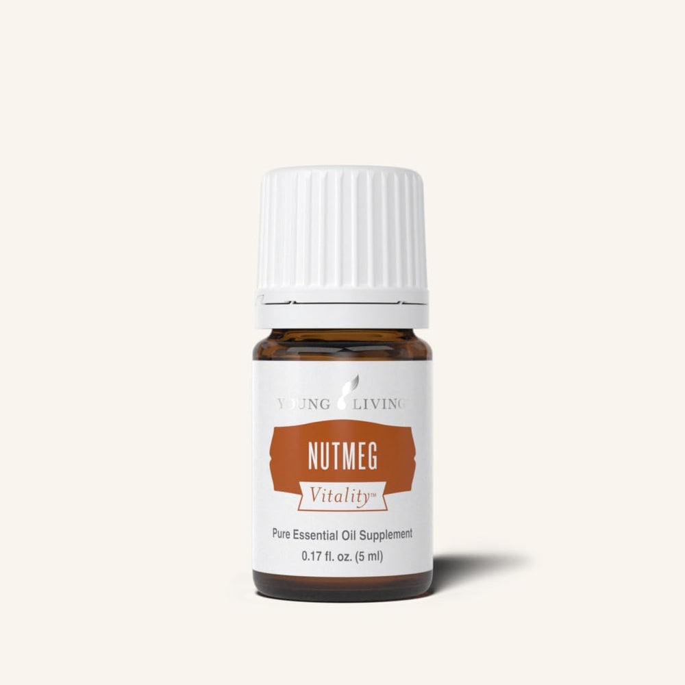 Young Living Nutmeg Vitality amber oil bottle signals premium culinary use.