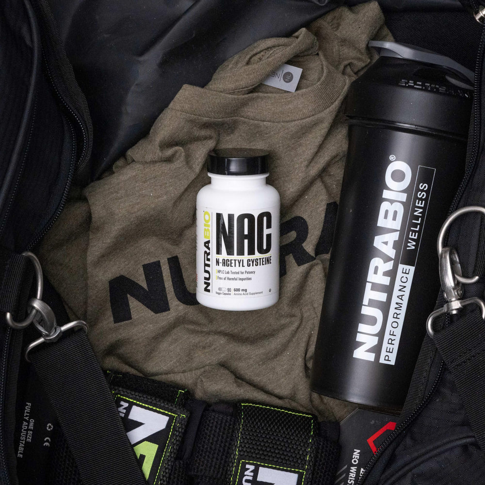 NAC capsules next to bottle on white surface