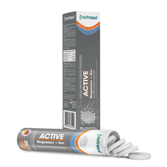 Orange flavored magnesium and zinc effervescent tablet dissolving in water