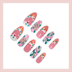 Nxtpz Rhinestone‑decorated gingerbread nails sparkle at holiday events
