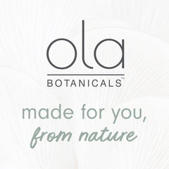 Ola Botanicals lemon oil bottle beside a cleaned surface for deodorizing use.