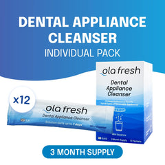 Close-up of Ola Fresh Denture Cleaner powder dissolving in water (mint)