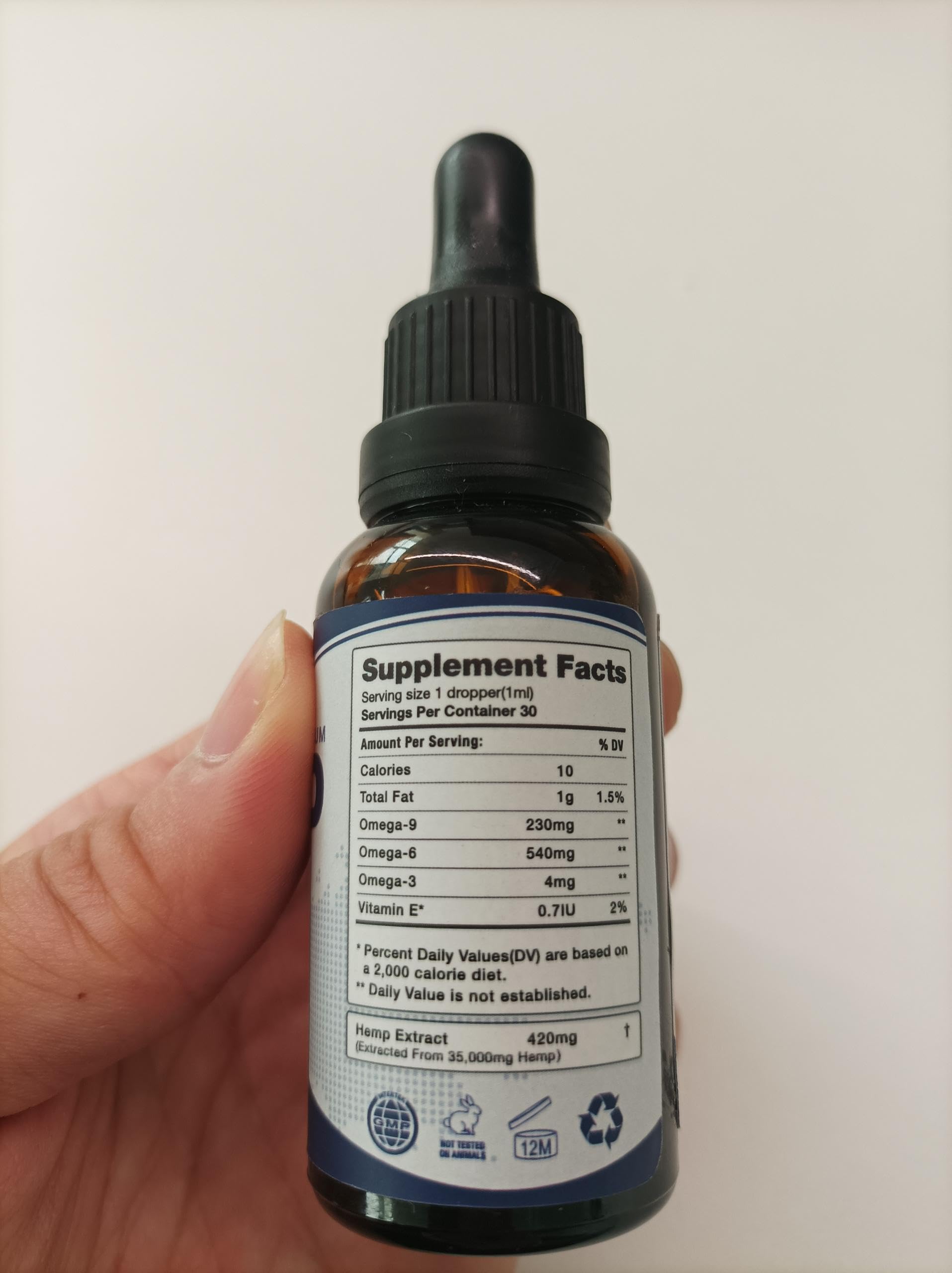 Close-up of CHANUB4ITO Omega 3-6-9 oil bottle - 4 pack