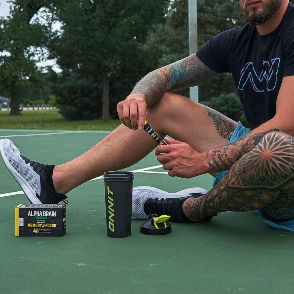 Close-up of ONNIT Alpha Brain Instant Pineapple Punch individual packets