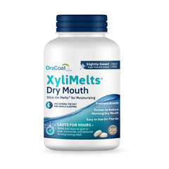 OraCoat XyliMelts discs adhered to teeth for dry mouth relief