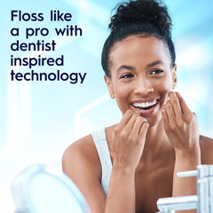 Close-up of Oral-B Glide PRO floss between teeth
