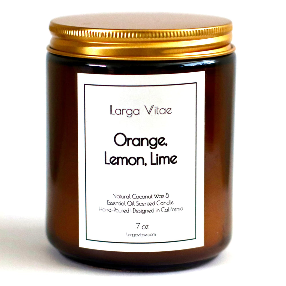 Citrus blend candle with orange, lemon, and lime aroma in amber jar