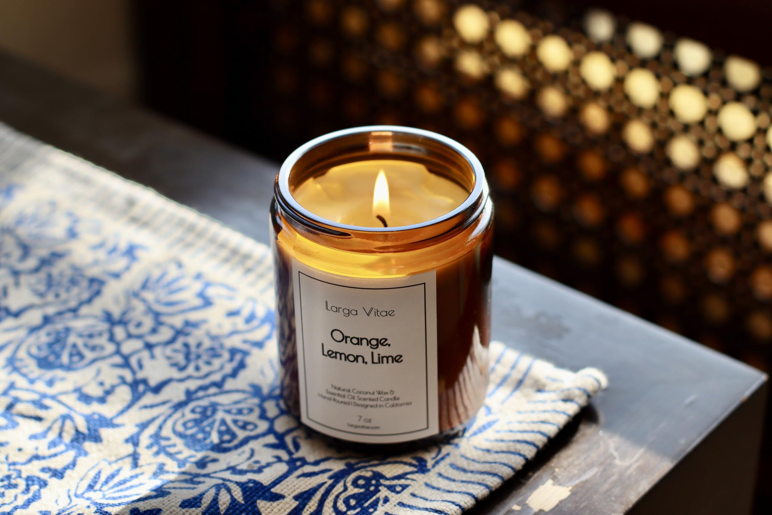 Citrus essential oil candle lighting a bright, fresh space