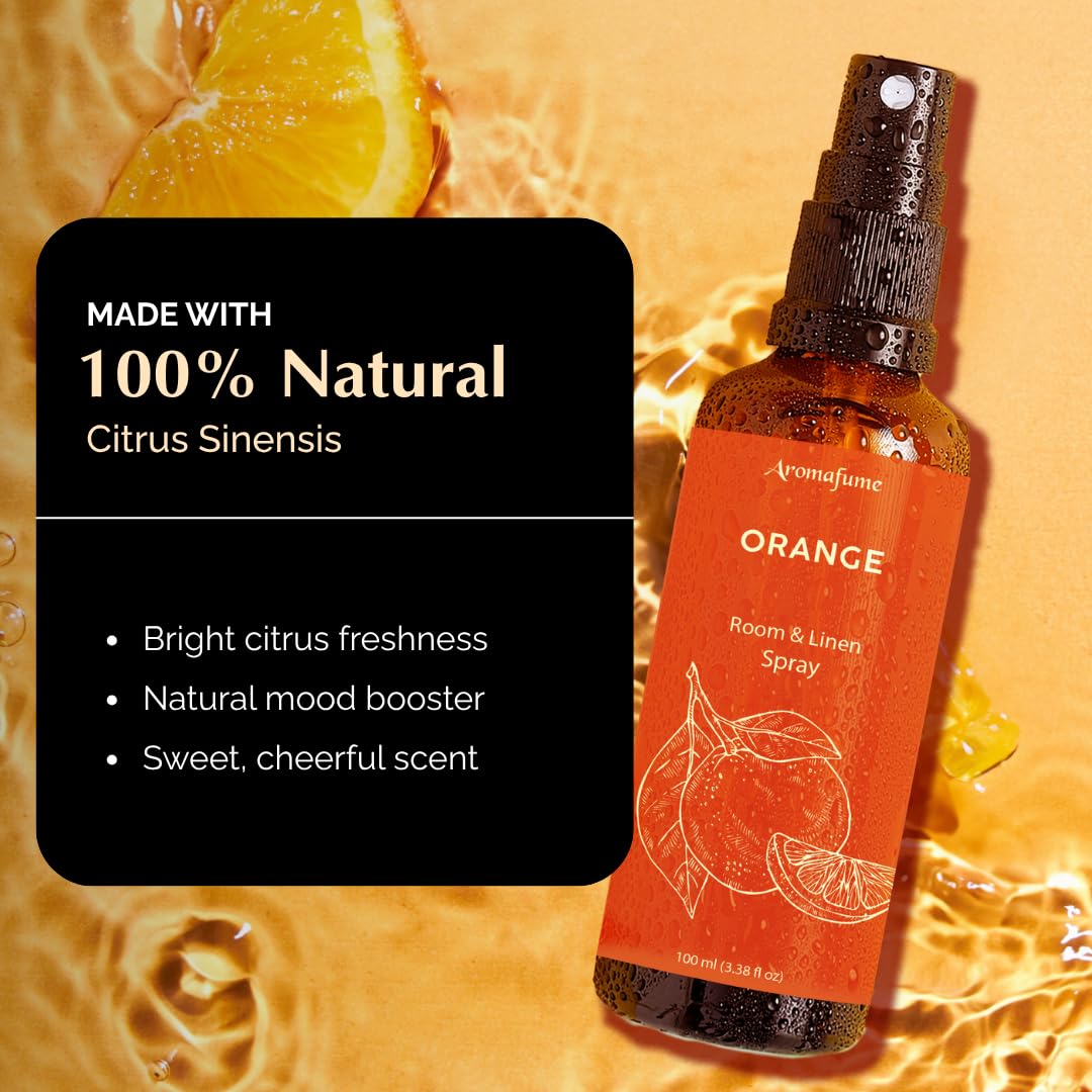 Close-up of spray bottle showing orange essential oil