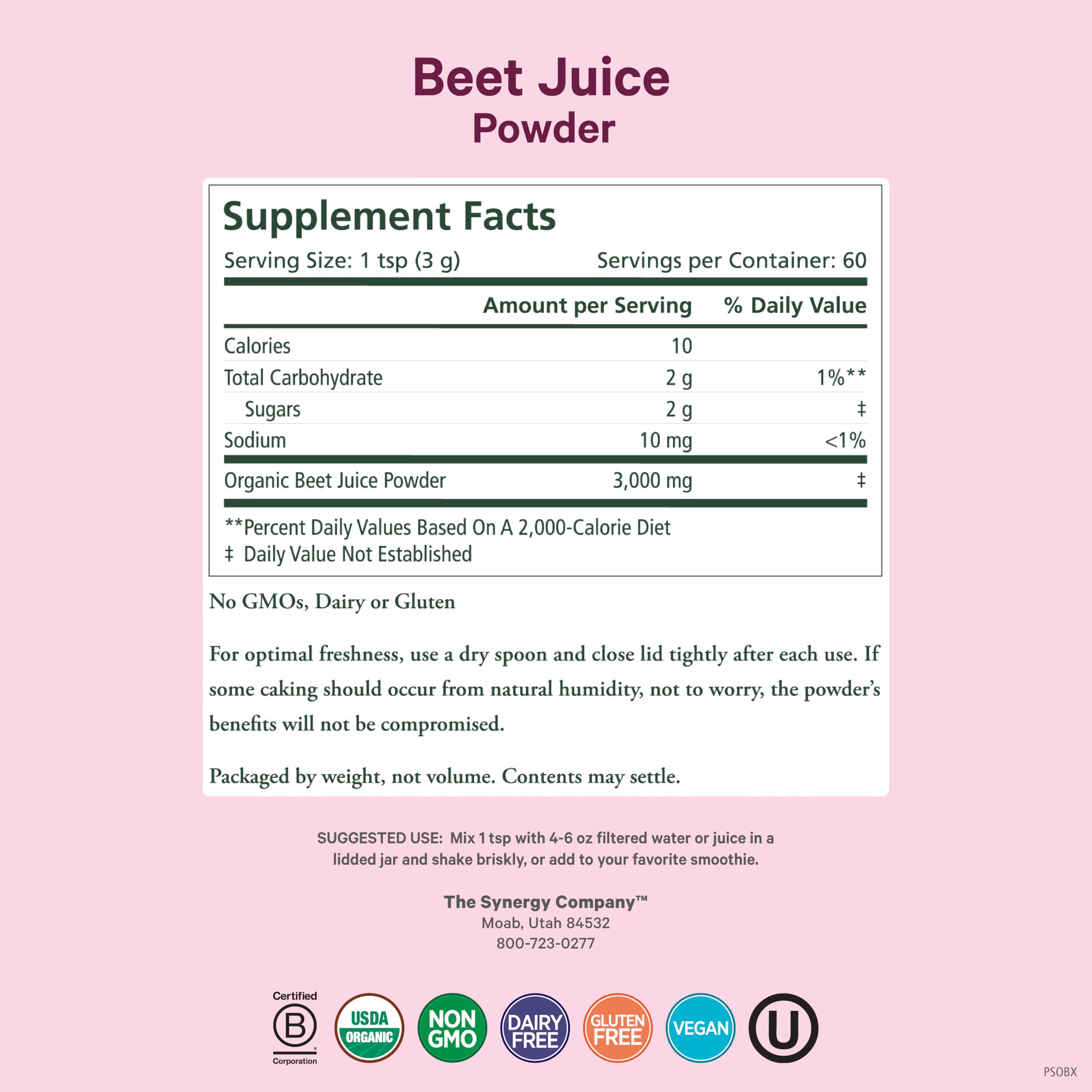 Scoop of beet juice powder with glass of water