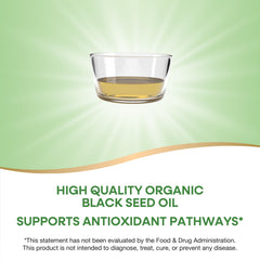 Organic cold-pressed unrefined black seed oil bottle close-up