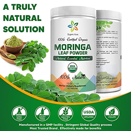Green moringa powder in a glass scoop
