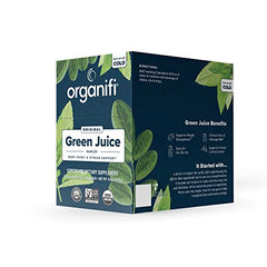 Glass of prepared Organifi GO Packs green juice showing vibrant color