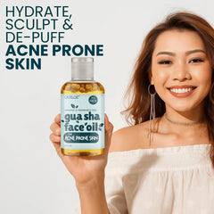 Gua Sha tool gliding with Ouiloe oil on skin.